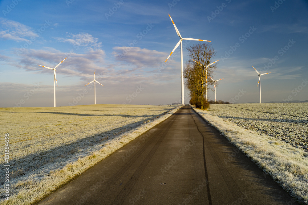 windmills on a frosty, winter field