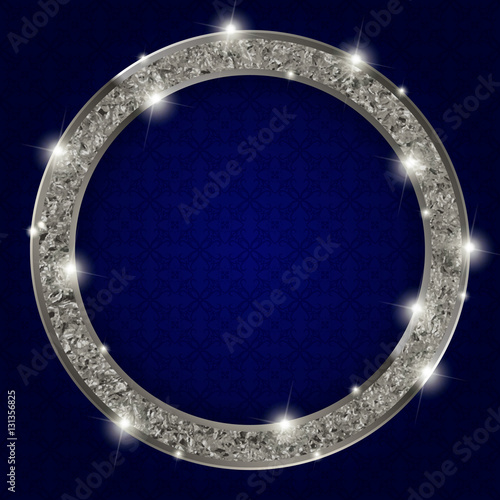 round silver frame with lights on dark background