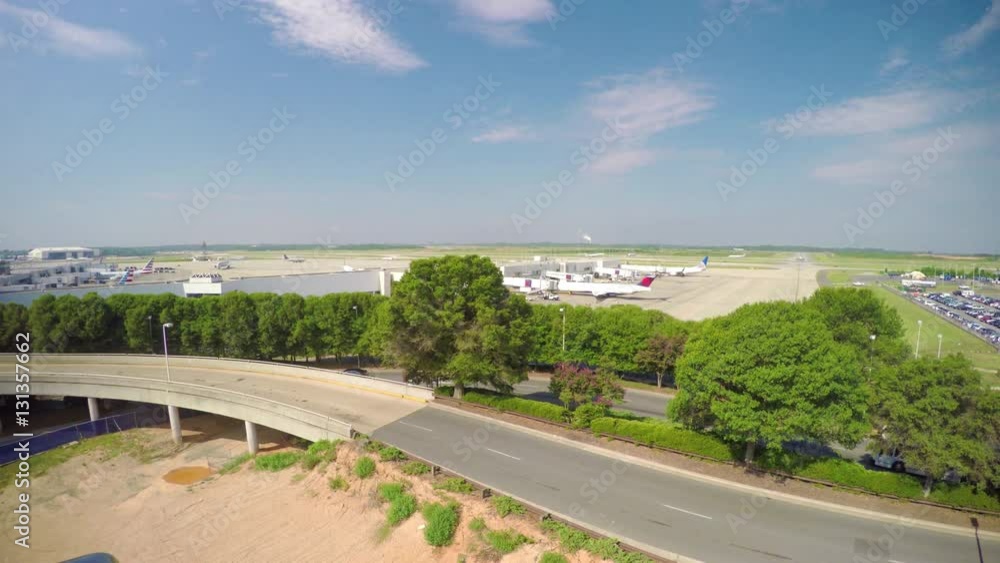 Charlotte Douglas International Airport CLT Wide Establishing Shot with Entering Vehicle Traffic on a Sunny Day in North Carolina Charlotte Douglas International Airport CLT Wide Establishing Shot with Entering Vehicle Traffic on a Sunny Day in North Carolina