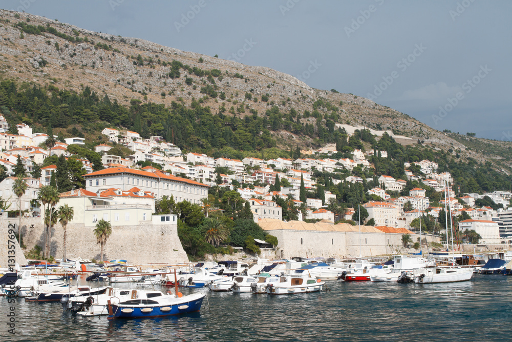 View of the old fort and a small harbor with boats. Dubrovnik, Croatia