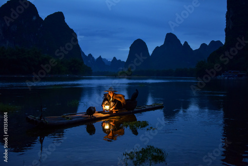 Fisherman of Guilin  Li River and Karst mountains during the blue hour of dawn Guangxi  China