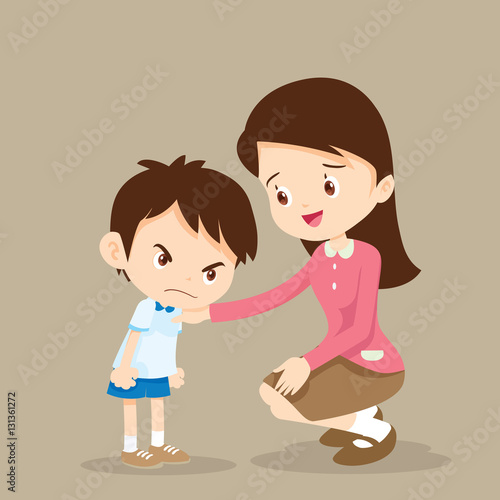 Teacher consoling angry boy.