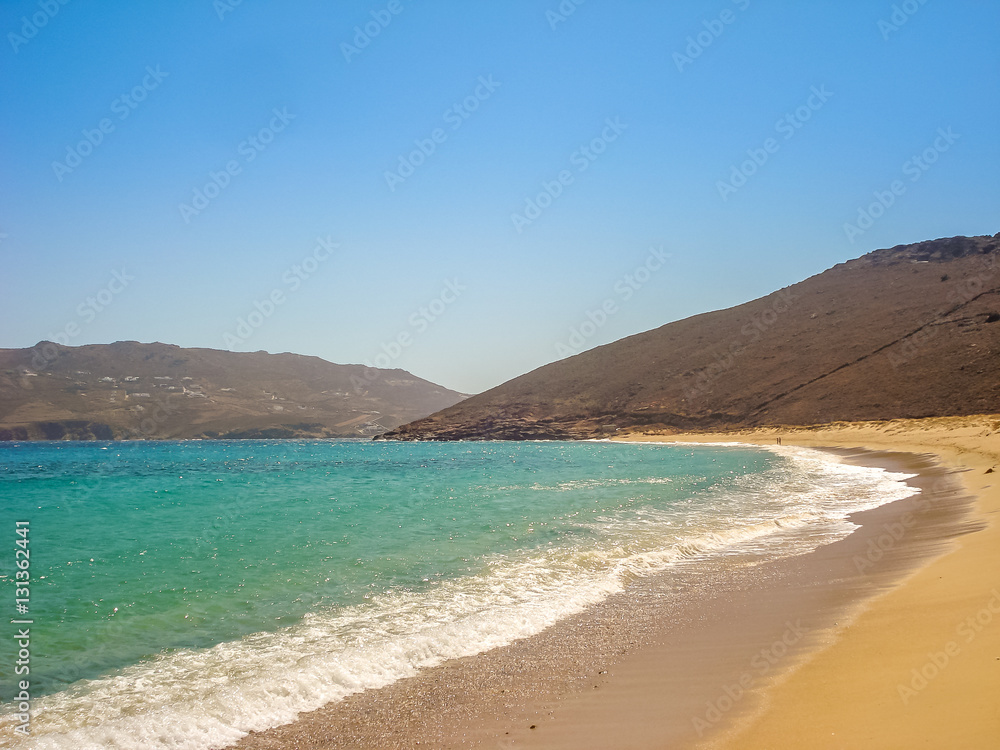 Ftelia beach under the blue sky in Mykonos, Greece Ftelia beach under the blue sky in Mykonos, Greece