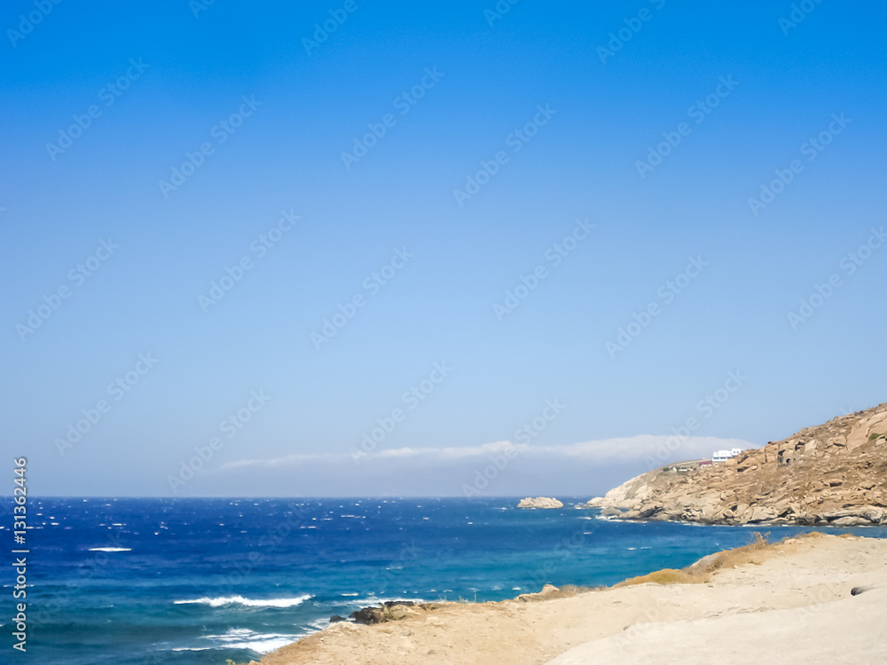 Beach in Mykonos under  the blue sky