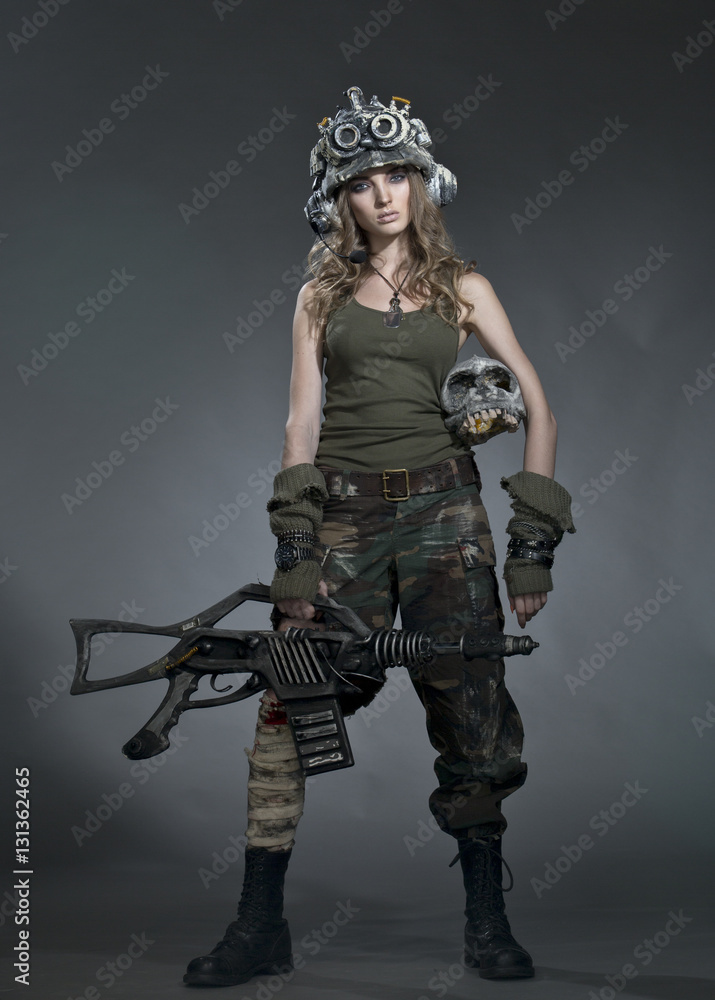Very beautiful girl - soldiers - the future, in a helmet and with an unusual gun in his hand, after the fight. Very beautiful girl - soldiers - the future, in a helmet and with an unusual gun in his hand, after the fight.
