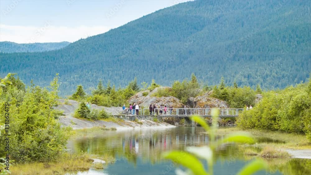 Visitors Exploring the Nature Trails of Tongass National Park at Mendenhall Glacier near Juneau Alaska Visitors Exploring the Nature Trails of Tongass National Park at Mendenhall Glacier near Juneau Alaska