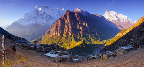 Horizontal Panoramic mountain view of Ghyaru village, Mountain Annapurna II and IV summits, in Pisang area, on Annapurna Circuit Trek, in Annapurna Himal, Himalaya, Nepal, Asia