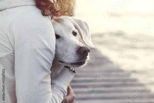 woman and her dog together outdoors