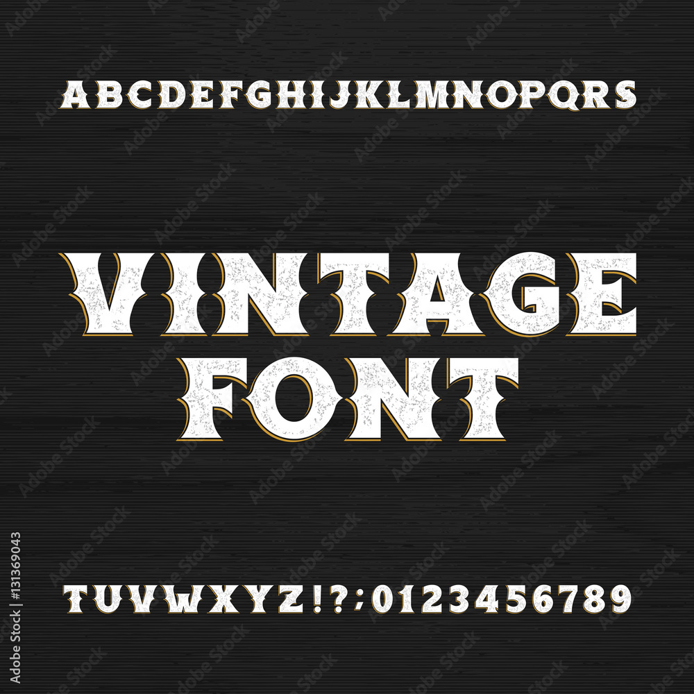 Vintage typeface. Retro distressed alphabet font on a wooden background ...