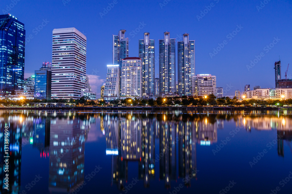 Bangkok's cityscape at night,looking across the lake at Queen Sirikit National Convention Center.
