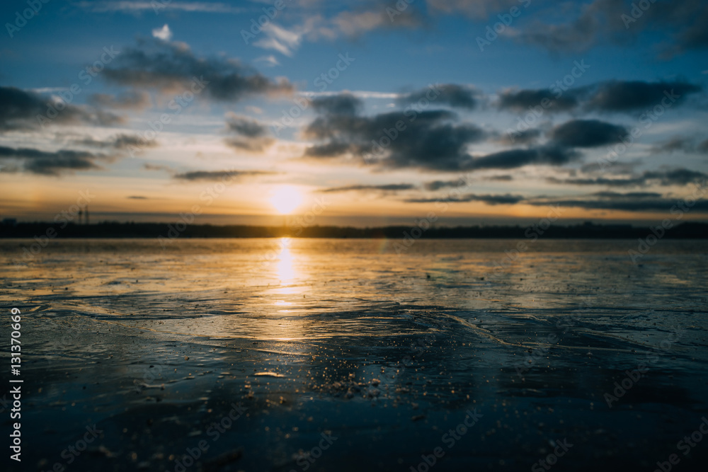 Fototapeta premium Frozen lake by sunset closeup