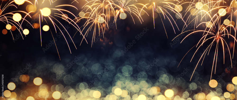 Gold and dark blue Fireworks and bokeh in New Year eve and copy space. Abstract background holiday. - obrazy, fototapety, plakaty 