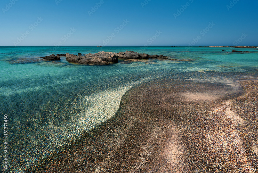 Greece, Crete, Elafonisi Beach. Pink sand at the water's edge