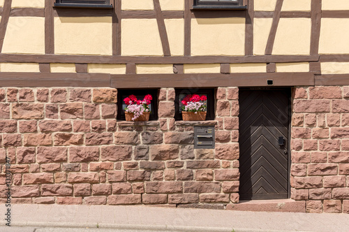 Eingangstür eines alten Bauernhauses in einem Schwarzwalddorf photo