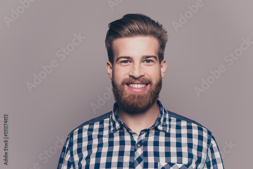 portrait of handsome smiling young man looking at camera isolate