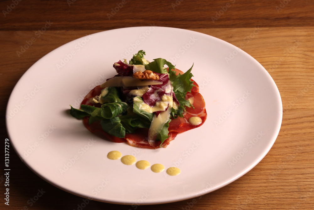 salad with salami. sauce of olive oil. salad with salami. sauce of olive oil.