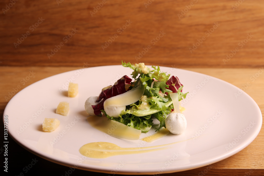 salad with mini mozzarella and parmesan. sauce of olive oil. salad with mini mozzarella and parmesan. sauce of olive oil.
