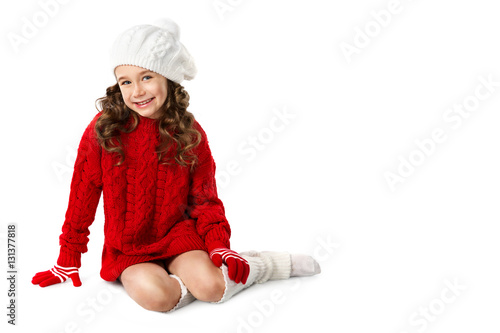 Fashion little girl in winter knitted clothes on isolated white background