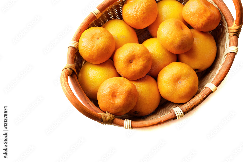 Organic mandarin in basket on a white background Organic mandarin in basket on a white background