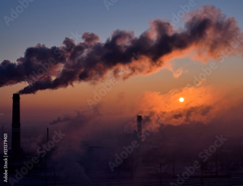 Smoking chimneys at sunrise