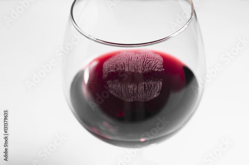 Glass of red wine with a kiss