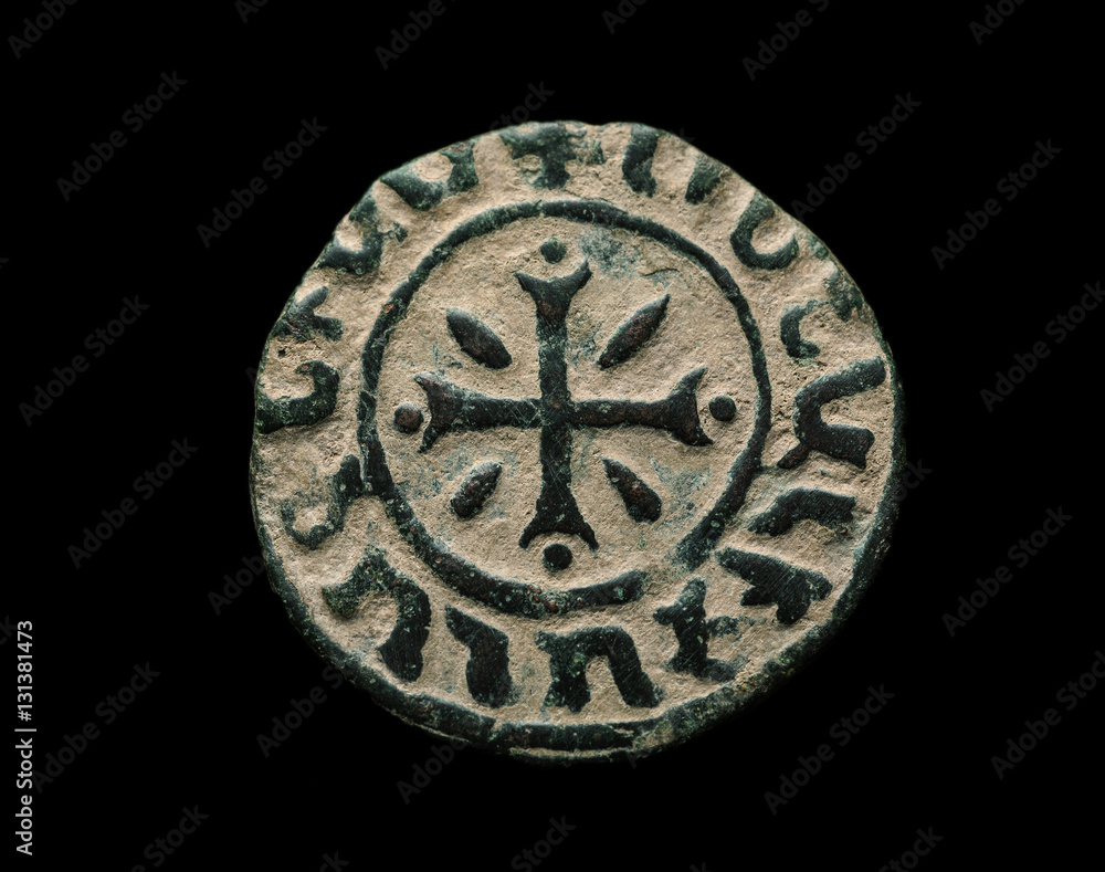 Ancient copper armenian coin isolated on black