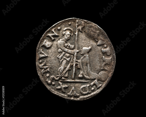 Ancient silver Venetian coin isolated on black