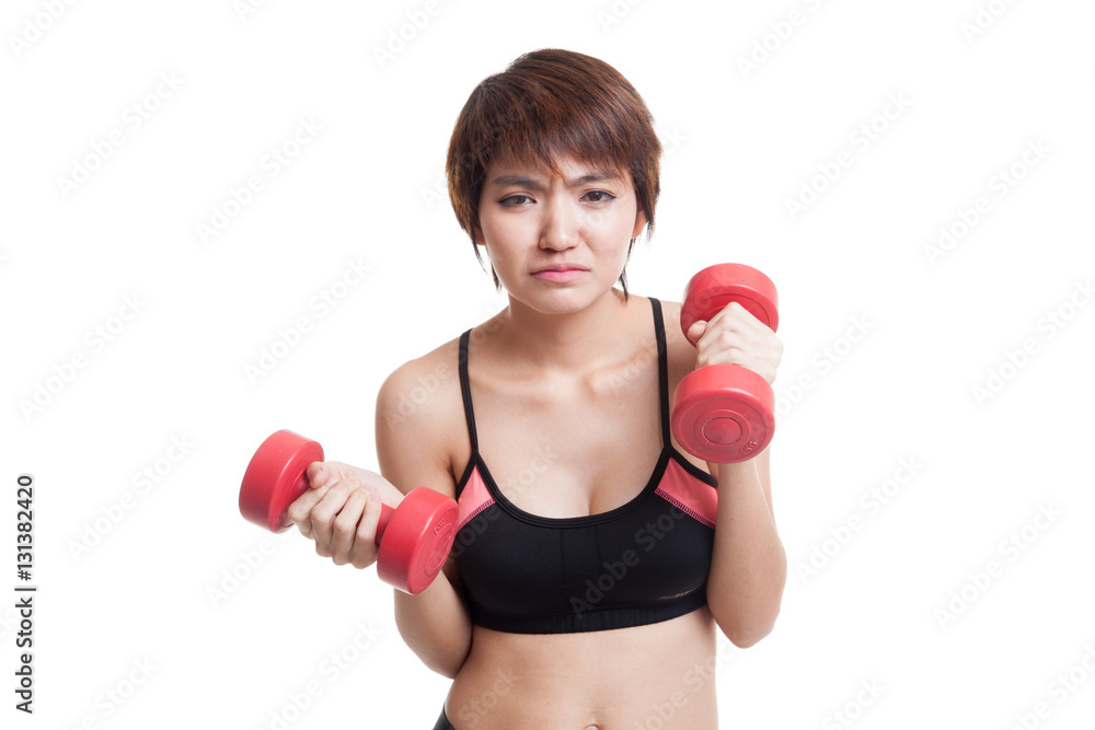 Tired Asian healthy girl exercise with dumbbell. Tired Asian healthy girl exercise with dumbbell.