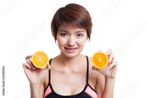 Beautiful Asian healthy girl with orange fruit.