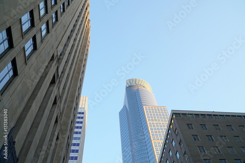 Look up view at downtown Minneapolis Minnesota skyscrapers. Center location for banking institution headquarters in north midwest at sunset