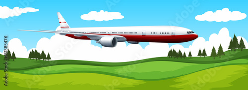 Airplane flying over the green field