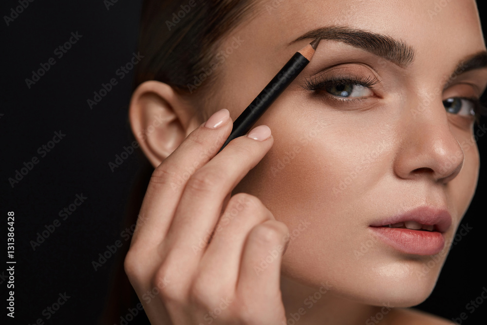 Beautiful Woman Contouring Eyebrows With Pencil. Beauty Beautiful Woman Contouring Eyebrows With Pencil. Beauty