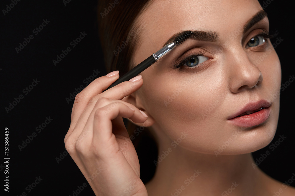 Beautiful Woman Brushing Eyebrows With Brush. Beauty Beautiful Woman Brushing Eyebrows With Brush. Beauty