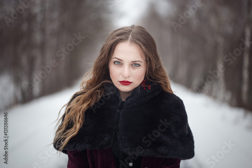 Winter portrait of a girl with long hair