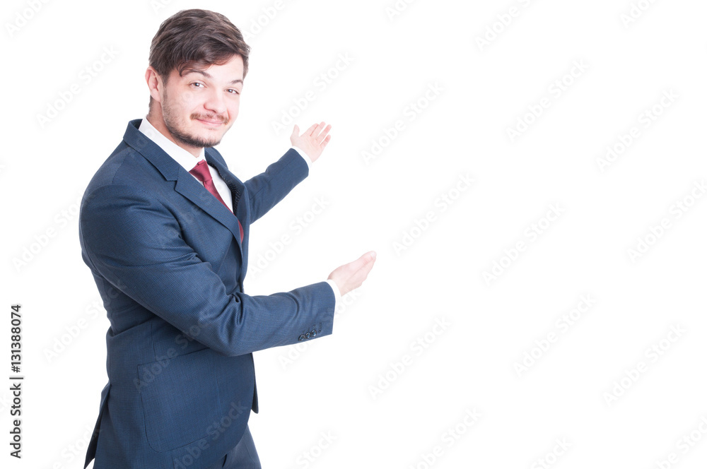 Business man or marketing manager standing and showing copyspace Business man or marketing manager standing and showing copyspace