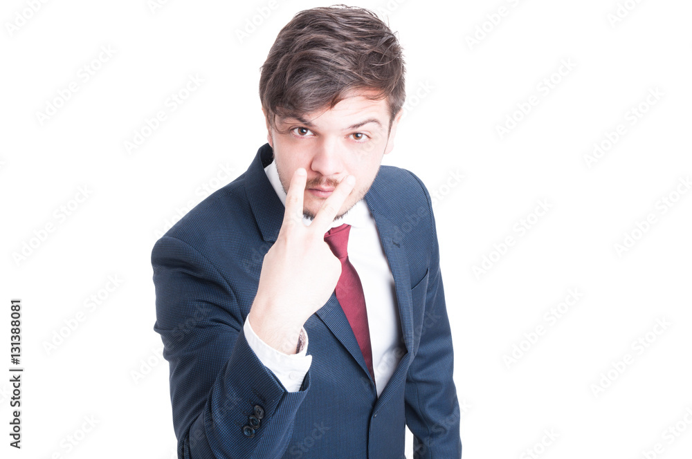 Business man making look into my eyes gesture Business man making look into my eyes gesture
