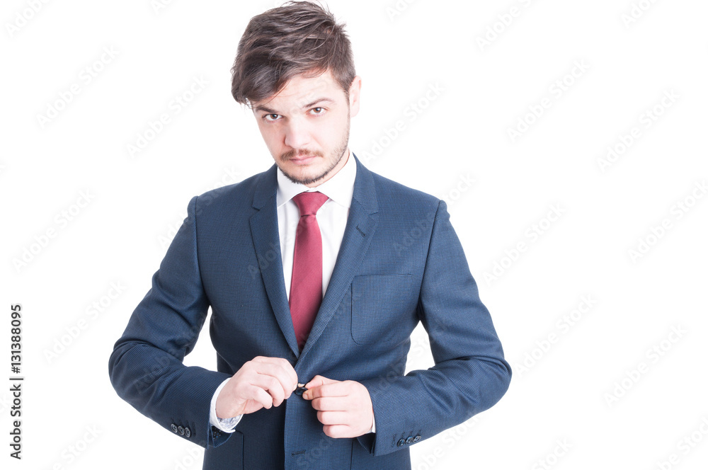 Portrait of business man closing his suit jacket Portrait of business man closing his suit jacket
