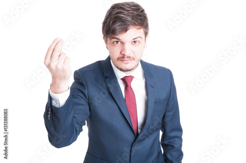 Business man standing looking angry explaining something