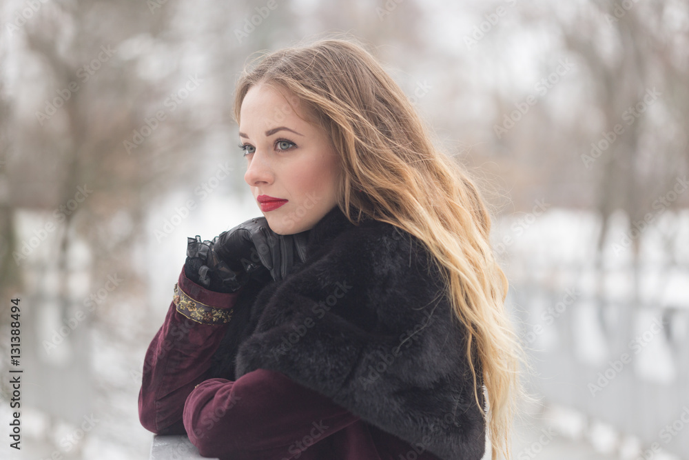 beautiful girl standing on the pedestrian bridge in winter beautiful girl standing on the pedestrian bridge in winter