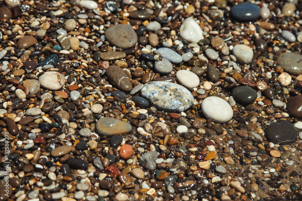 Close up of a pebble beach with the sea. Close up of a pebble beach with the sea.