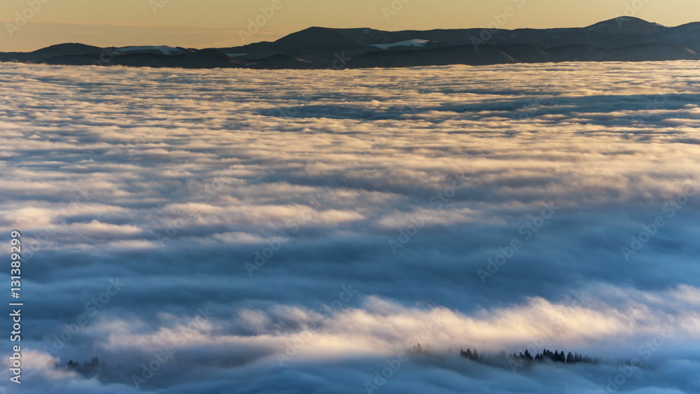 Dense fog rolling through Carpathian mountains. winter landscape. Dense fog rolling through Carpathian mountains. winter landscape.