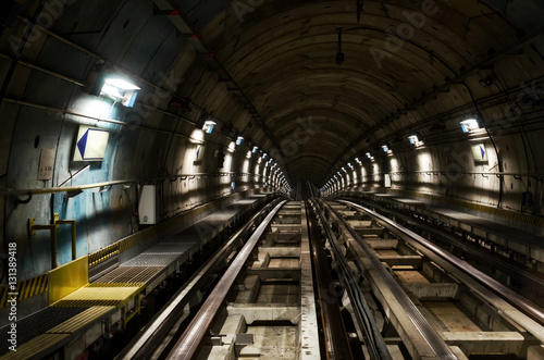 Metro subway of Turin (Italy), dark tunnel with rails seen from the train