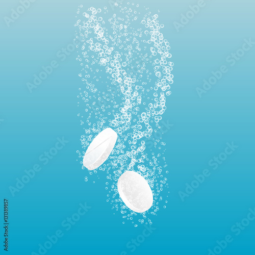Two dissolving tablets. Soluble pill on transparent background. Effervescent tablet. Vitamin C.