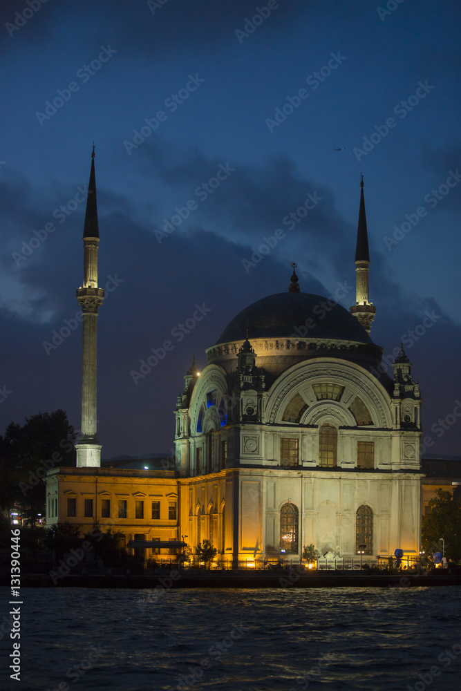 Dolmabahce Mosque (Aka Bezmi Alem Valide Sultan Mosque) at night in Istanbul Turkey