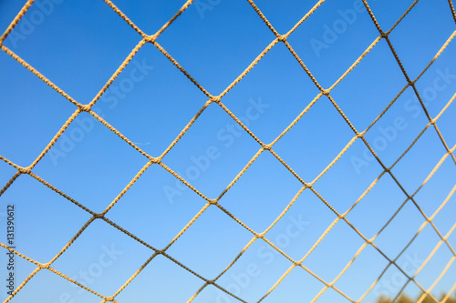 Принти на полотні Football net on blue sky background