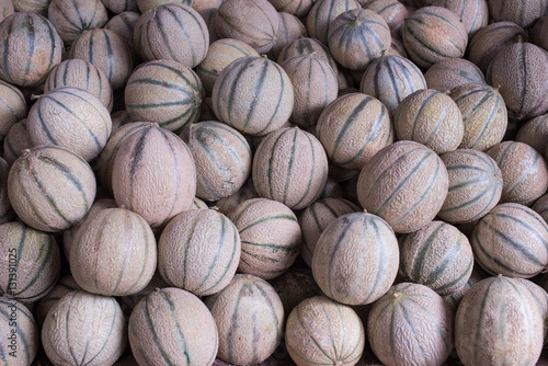 Small round striped melons on counter at Moroccan market