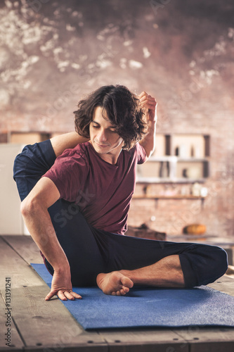Young man practicing yoga meditation