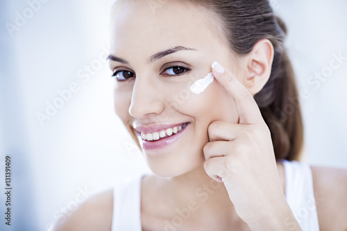 Woman Applying Face Cream photo