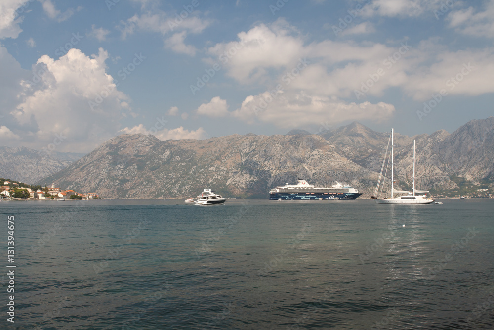 cruise liner and sailing yacht and boats in the Bay of Kotor. Montenegro