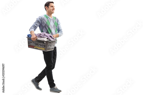 Fotografie Guy carrying a laundry basket